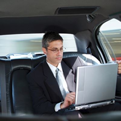 Executive Sitting In A Limo
